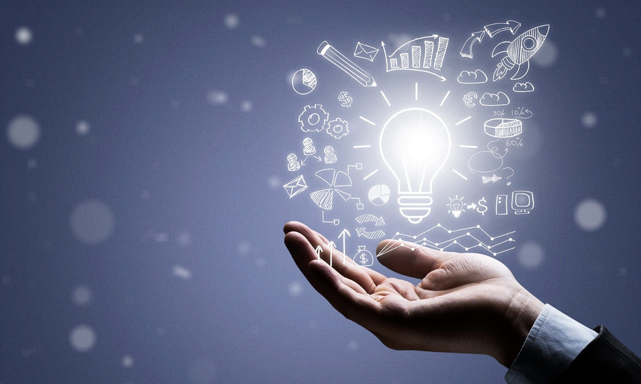 A hand holding a graphic of a lightbulb, representing a business leader's different AppSec needs